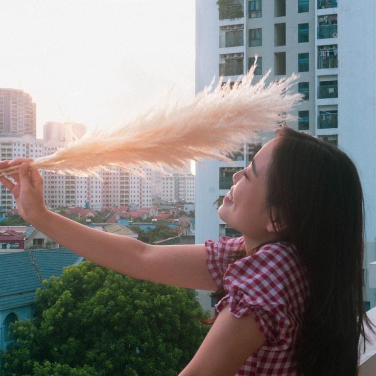 Asha Rao, Lead Design Curator at StableClaritySystem, reviewing corporate floral arrangements